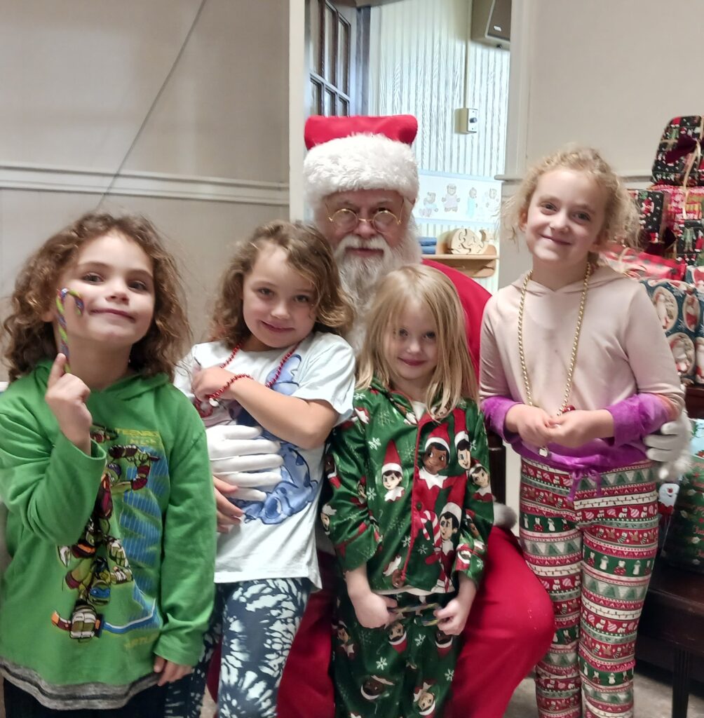 Kids taking a picture with Santa