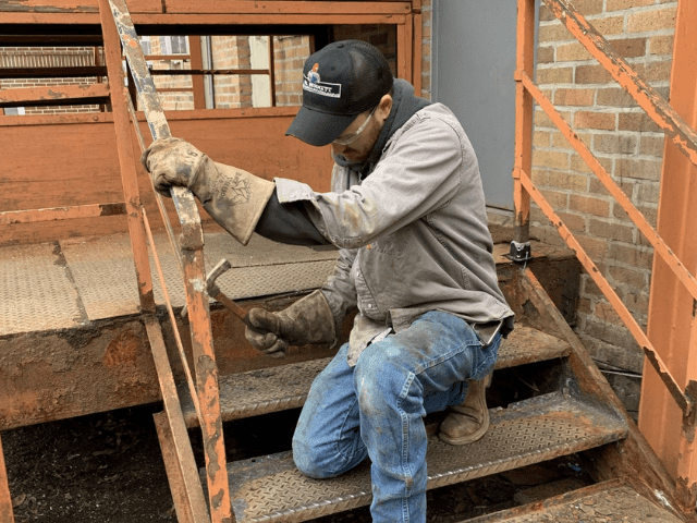 Gentleman repairing stairs at Friends of the Homeless of Tuscarawas County
